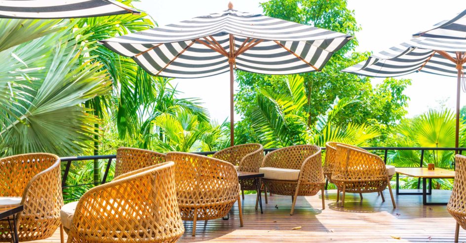 empty outdoor patio table and chair with cushions