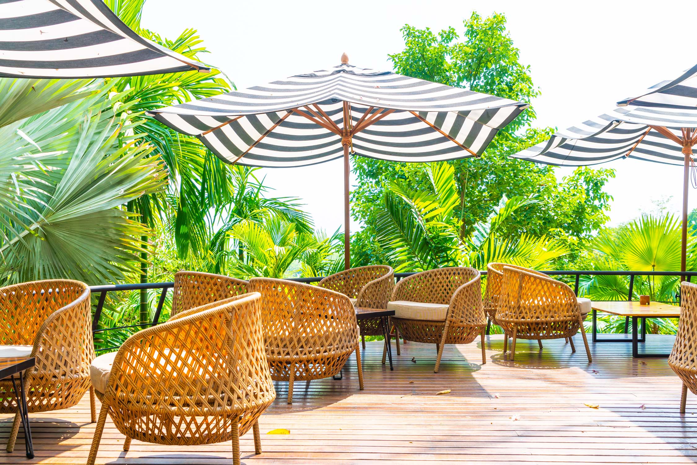 empty outdoor patio table and chair with cushions