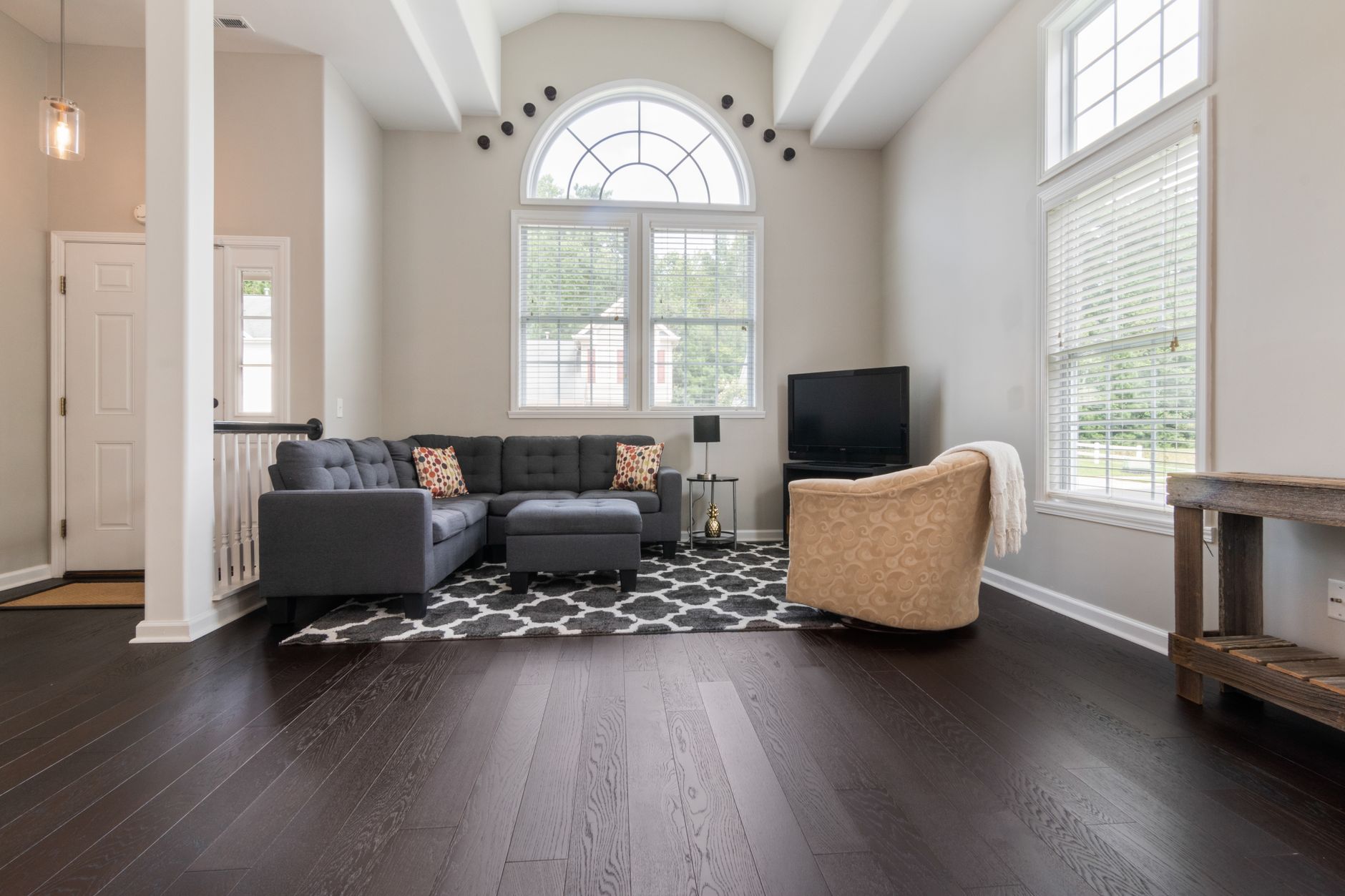 Engineered hardwood flooring in a sunlit sunroom