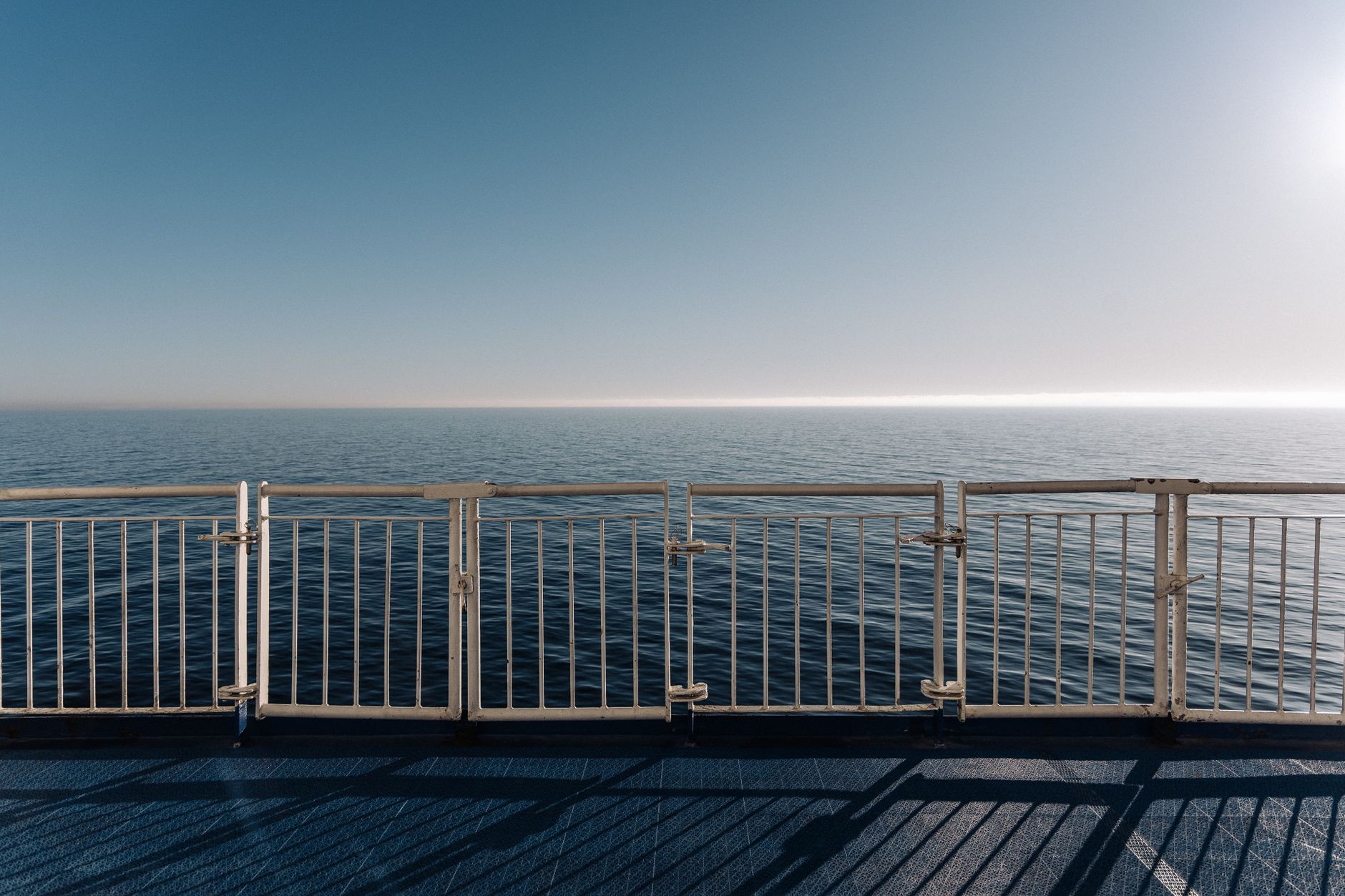 Composite deck railing along an outdoor deck staircase