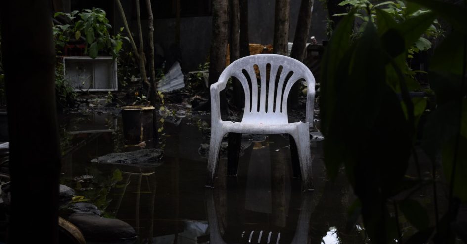Standing water pooling on a New Orleans backyard patio after heavy rain