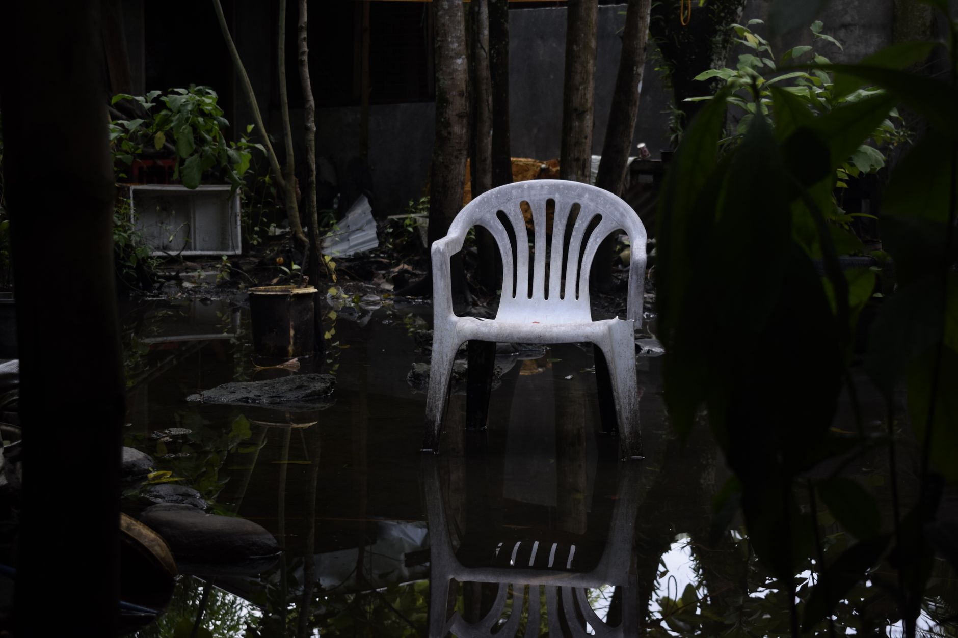 Standing water pooling on a New Orleans backyard patio after heavy rain