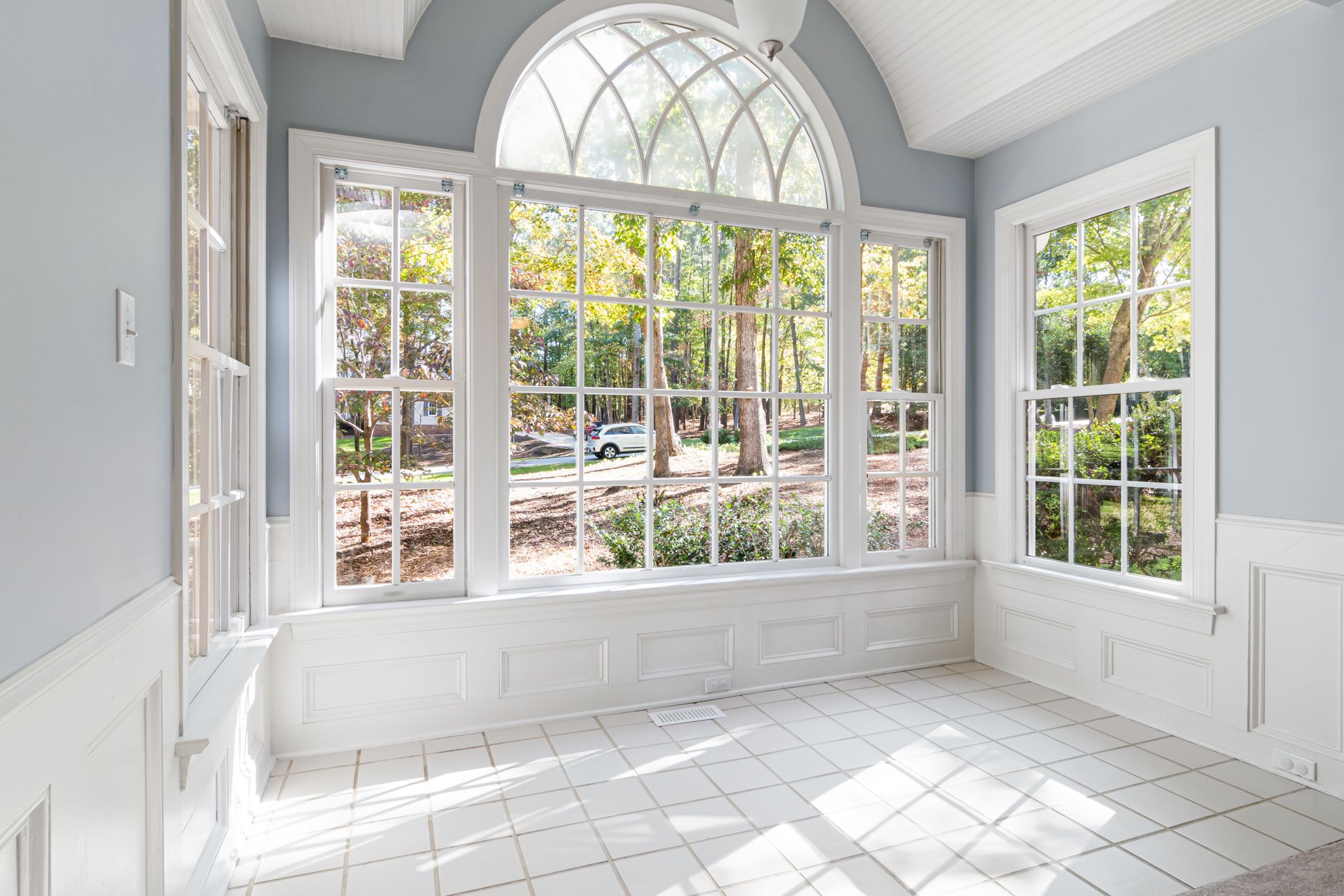 Bright comfortable sunroom with large windows staying cool and pleasant year round