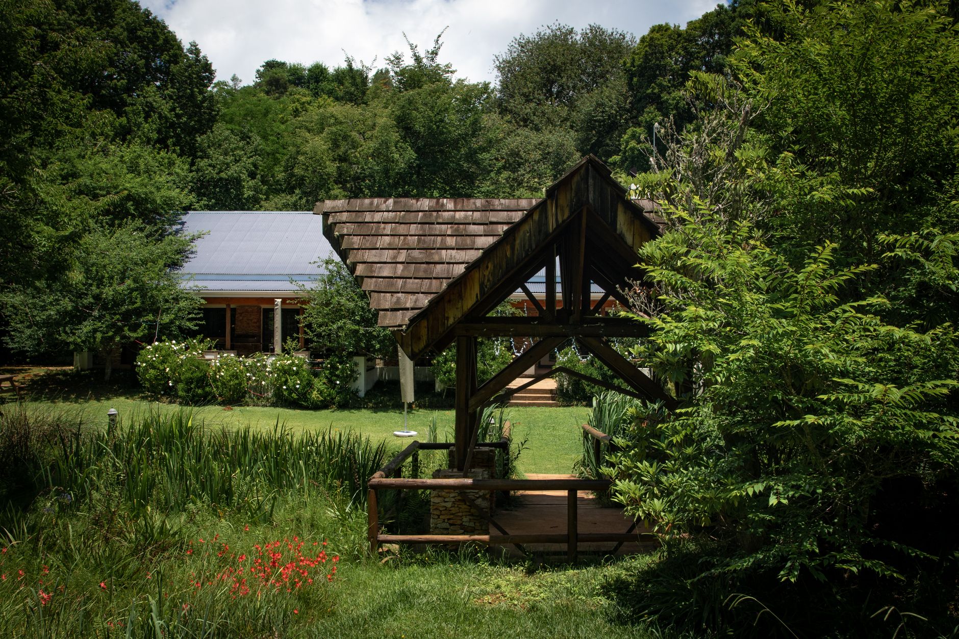 Gazebo placed along a garden pathway with clear sightlines