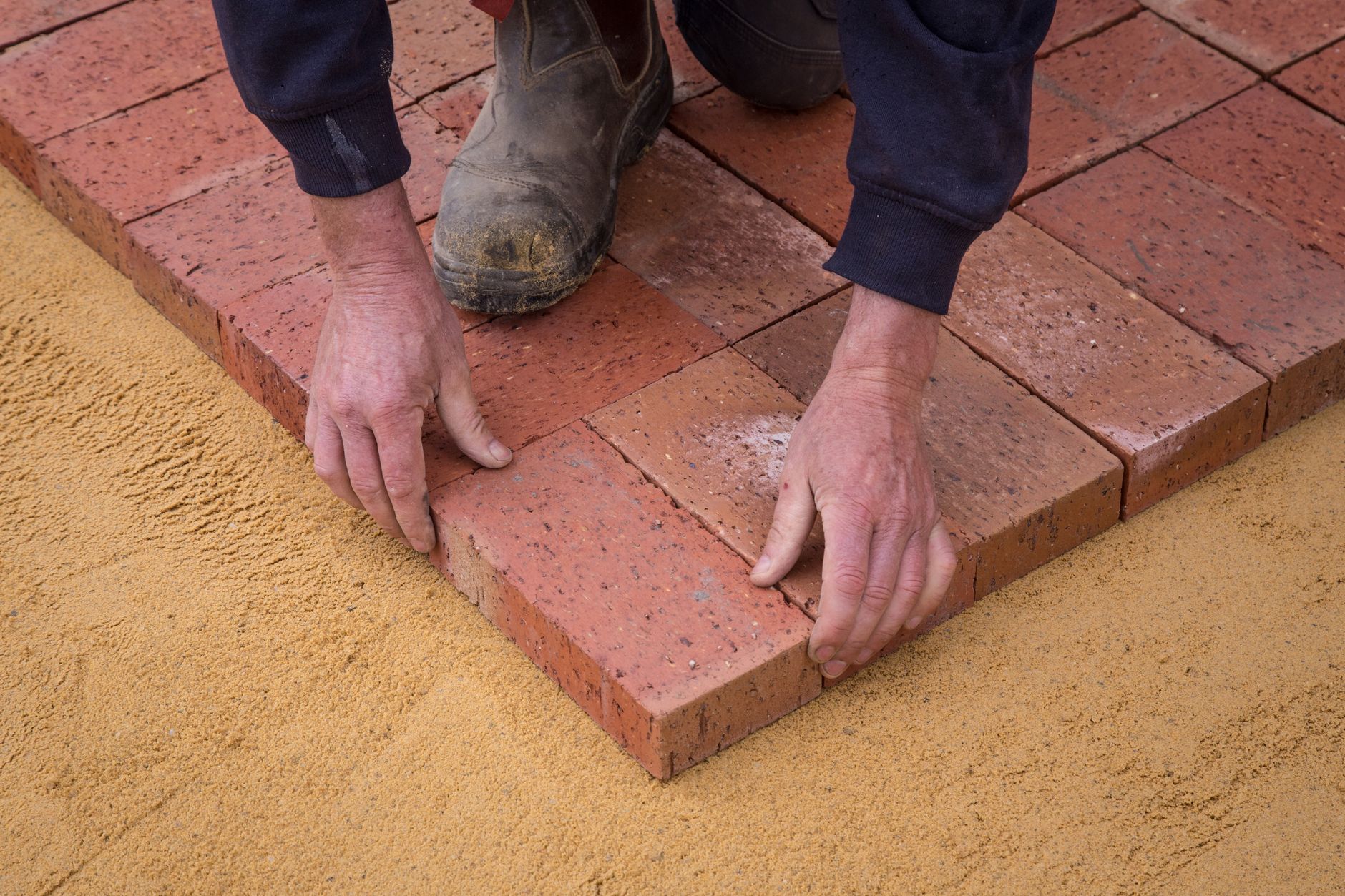 Laying brick pavers in a square pattern