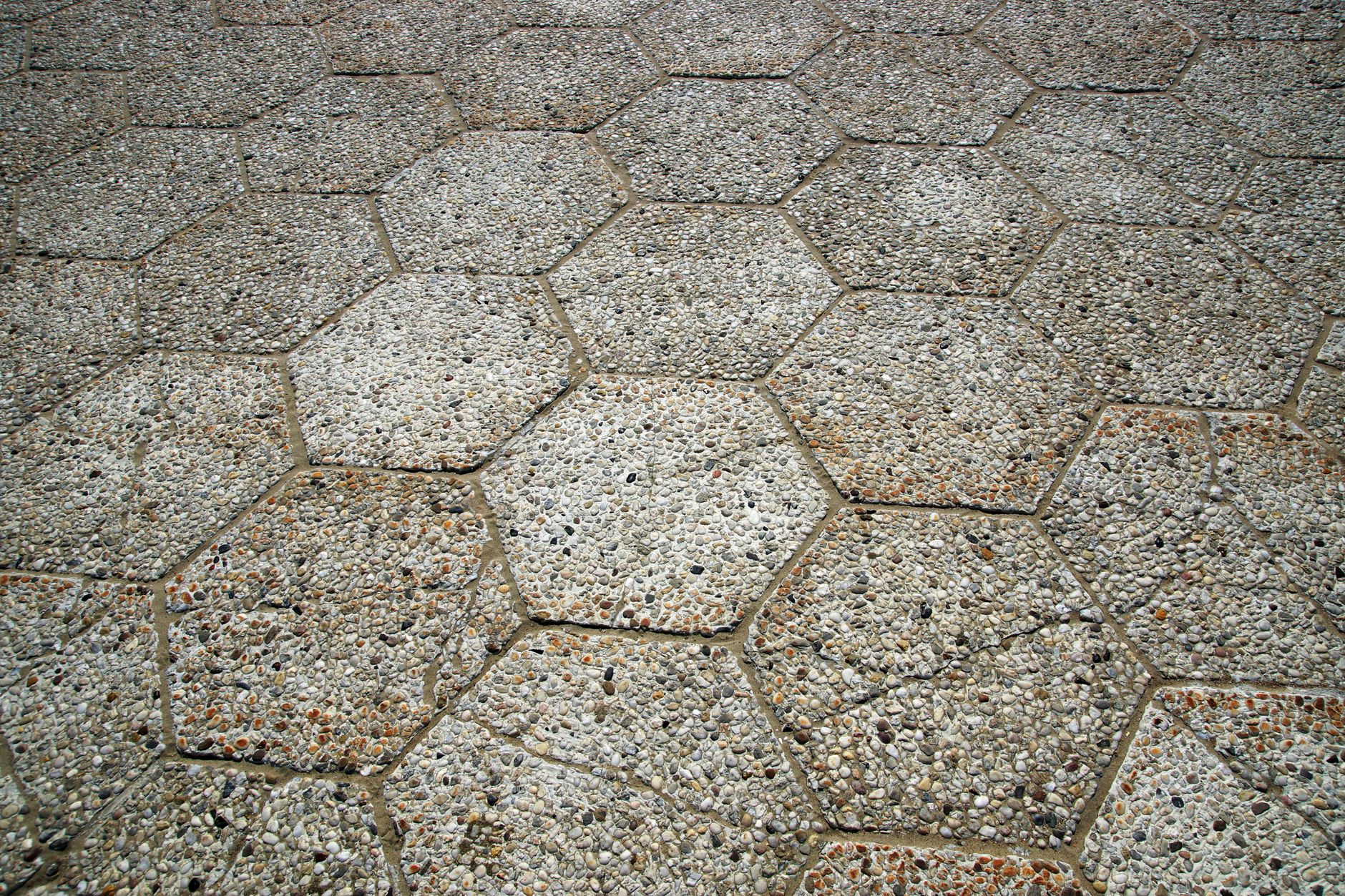 Permeable paver patio installed to prevent standing water in a New Orleans backyard