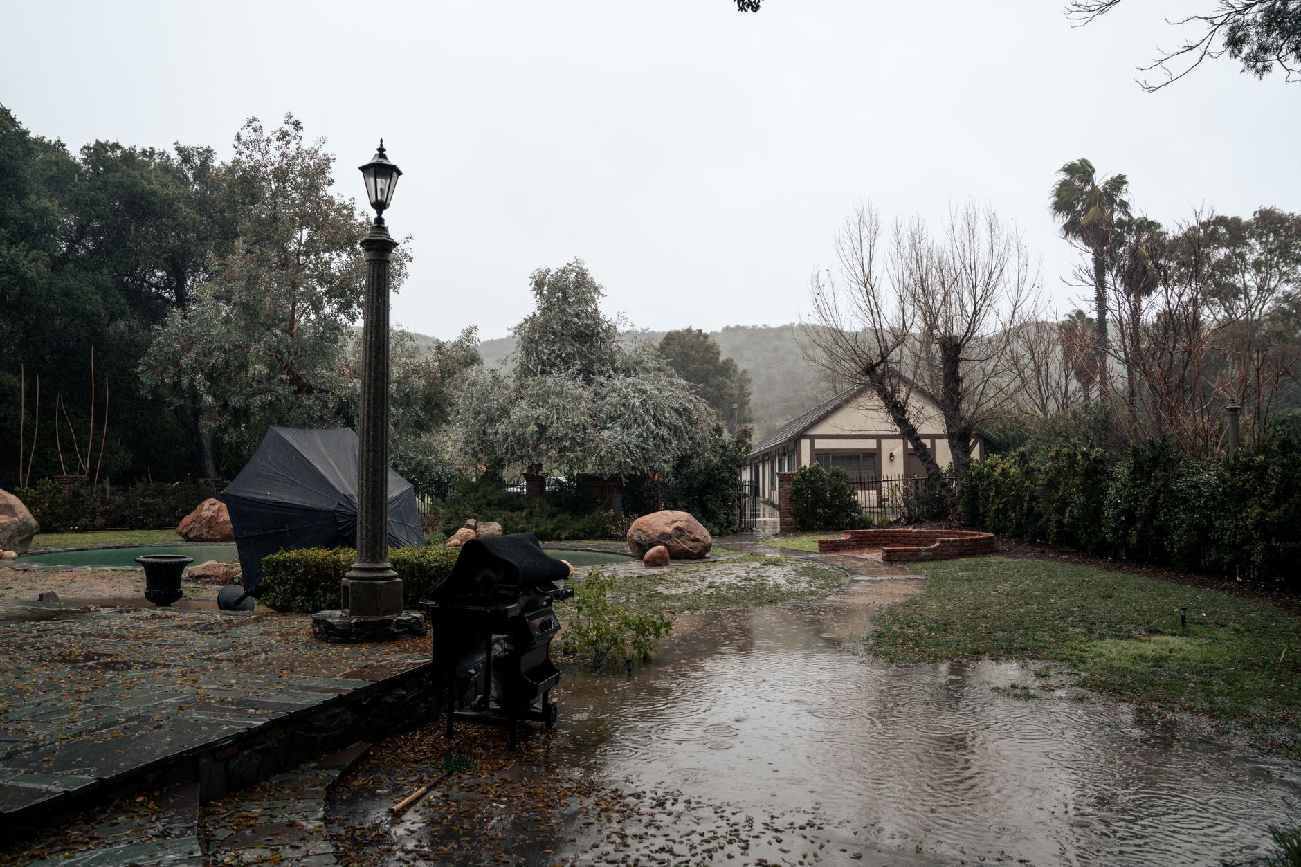 Backyard drainage checked for standing water before hurricane season