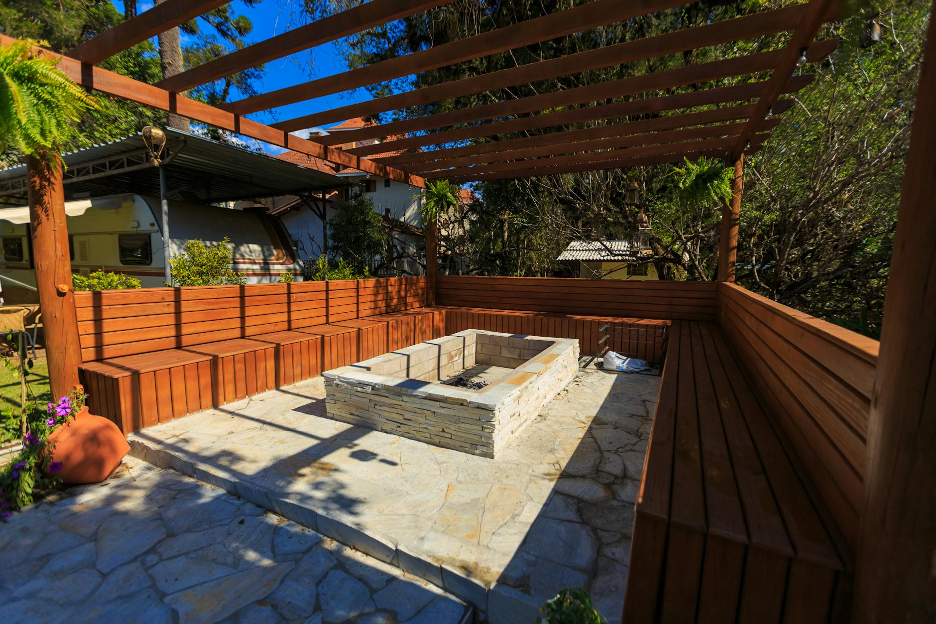 Pergola and fire pit entertaining area in a New Orleans backyard