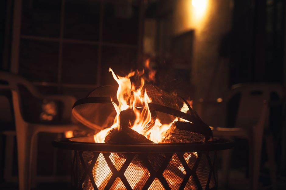 Content image 2  - A fire pit lounge integrated with a paver patio and string lights