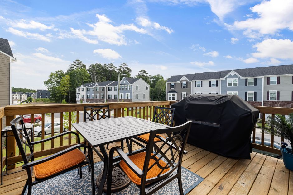 Content image 2  - A raised deck with railing overlooking a backyard