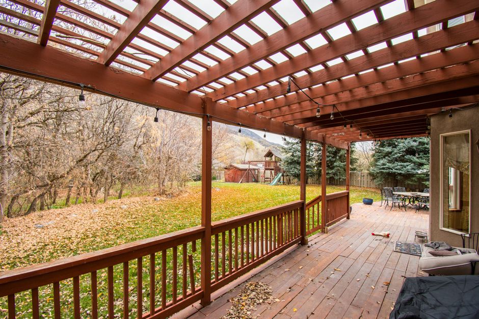 Content image 2 - A pergola with flowing outdoor curtains for privacy and shade