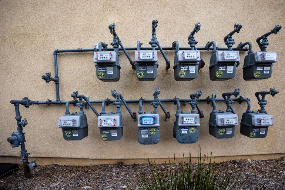Content image 1 - A close-up of gas line connections during outdoor kitchen construction