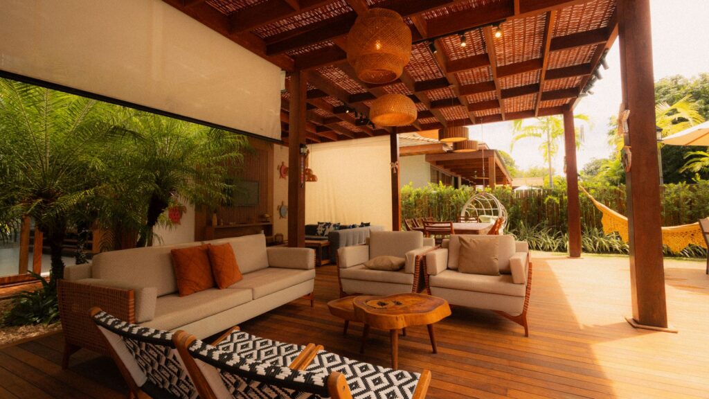 Wooden pergola providing filtered shade over an outdoor seating area